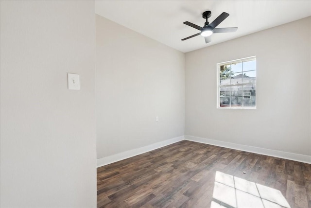 unfurnished room with ceiling fan and dark hardwood / wood-style flooring