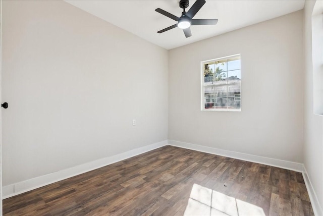 spare room featuring ceiling fan and dark hardwood / wood-style flooring