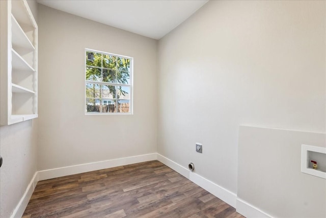 washroom with dark hardwood / wood-style flooring, hookup for a washing machine, and electric dryer hookup