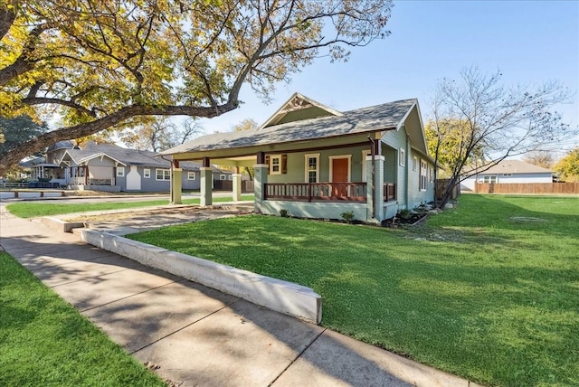 view of front facade featuring a front lawn and covered porch