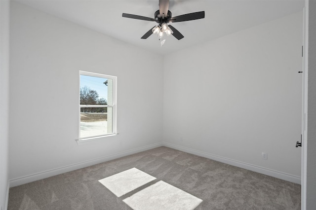 empty room with light colored carpet and ceiling fan