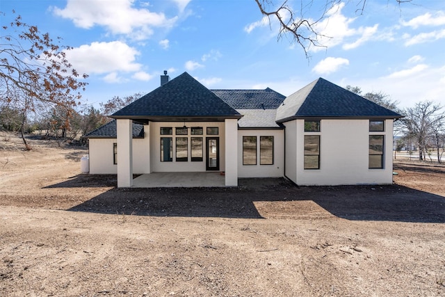 305 Glade Valley Rd, Azle, TX 76020 - back of house with roof with shingles, a chimney, and a patio area