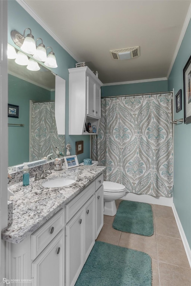 bathroom featuring toilet, vanity, tile patterned floors, and crown molding