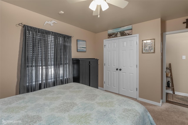 bedroom featuring carpet, ceiling fan, and a closet