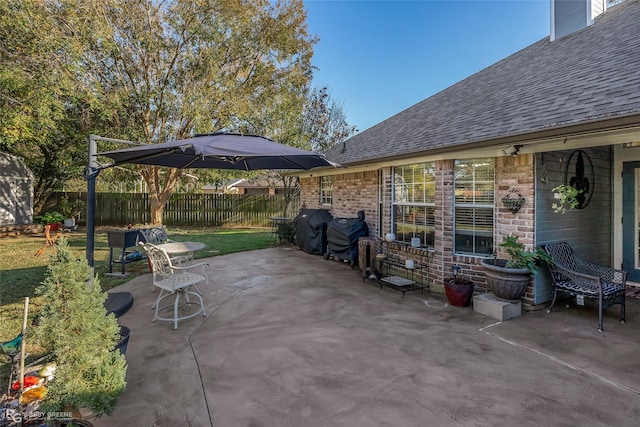 view of patio featuring a grill