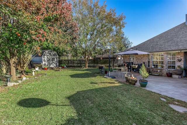 view of yard featuring a patio and a storage unit