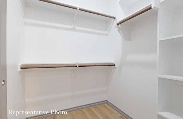 walk in closet featuring wood-type flooring