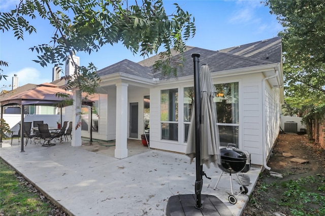 back of house with a gazebo and a patio area