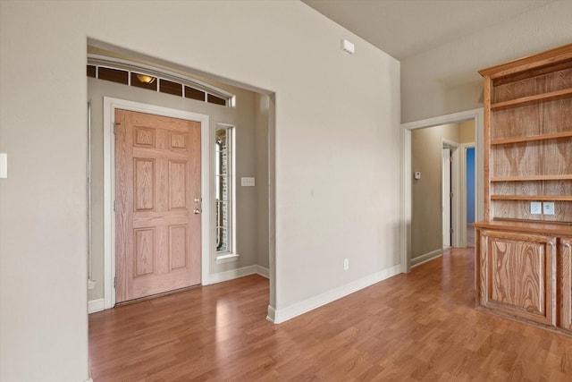 foyer with hardwood / wood-style flooring