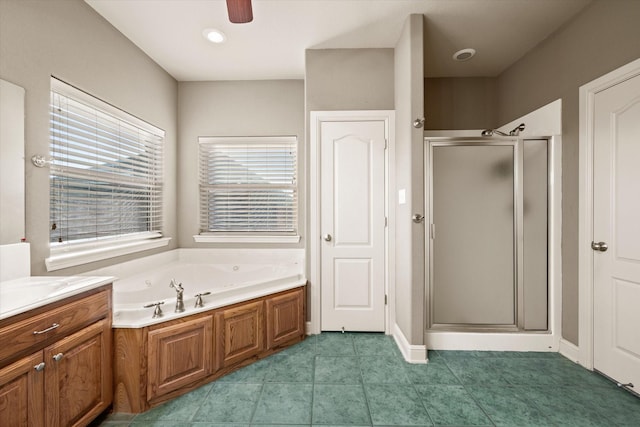 bathroom with tile patterned flooring, vanity, separate shower and tub, and ceiling fan