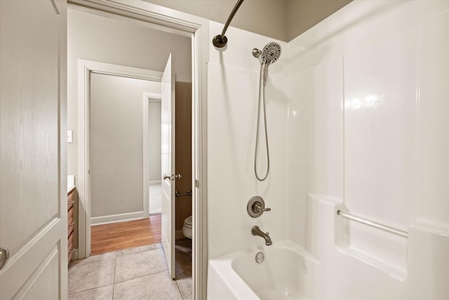 full bathroom with toilet, vanity, tub / shower combination, and hardwood / wood-style flooring