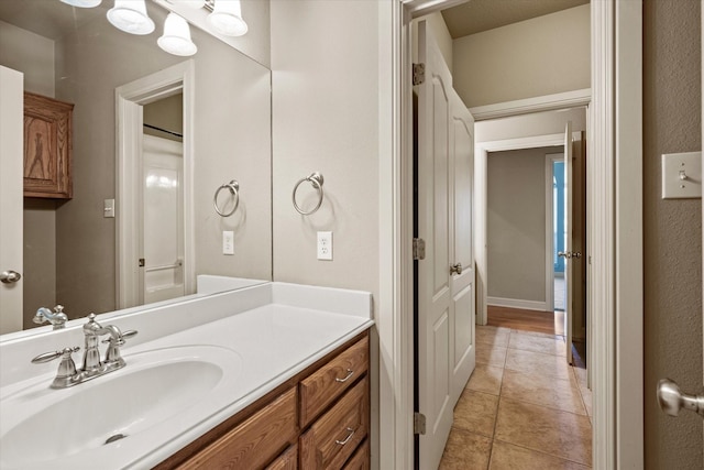 bathroom featuring tile patterned flooring and vanity