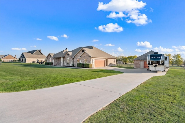 view of front of property with a front yard and a garage