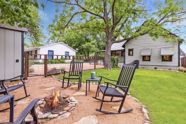 view of yard with a fire pit