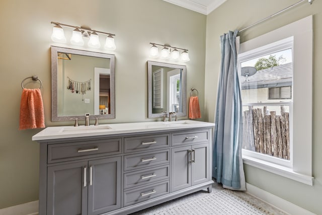 bathroom with crown molding and vanity