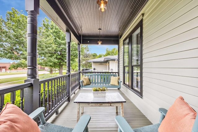 wooden deck featuring a porch