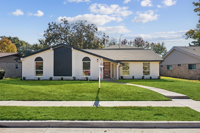 ranch-style house with a front yard