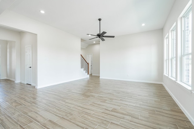 unfurnished living room featuring ceiling fan