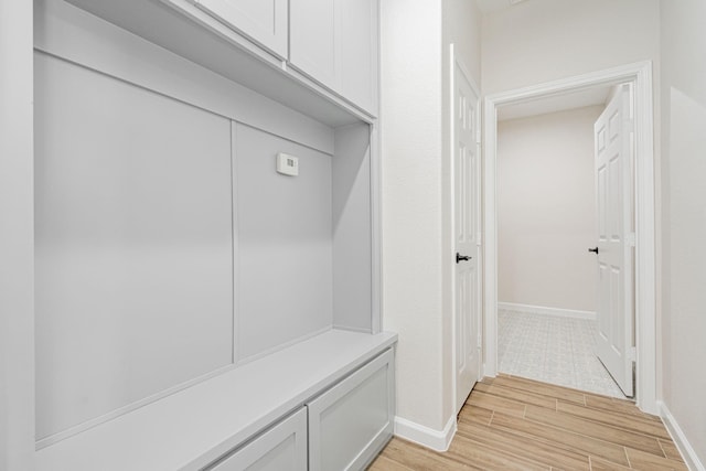 mudroom with light hardwood / wood-style floors