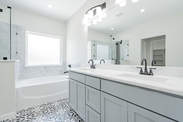 bathroom featuring vanity, separate shower and tub, and tile patterned flooring