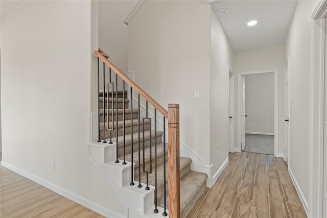 staircase featuring hardwood / wood-style floors