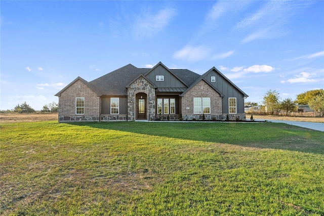 6292 Candy Oak Ct, Royse City, TX 75189 - view of front of property featuring board and batten siding, a front lawn, and stone siding