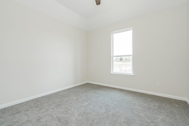 empty room with ceiling fan and carpet flooring