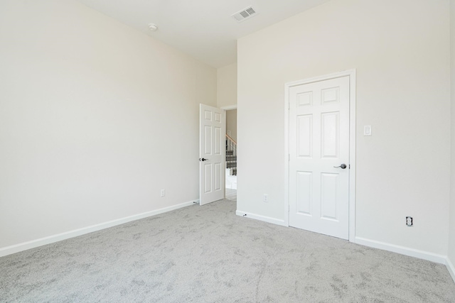 unfurnished bedroom with light colored carpet