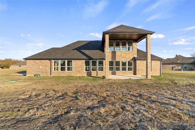 6292 Candy Oak Ct, Royse City, TX 75189 - rear view of house featuring brick siding, a patio, and a shingled roof