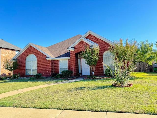 front facade with a front lawn