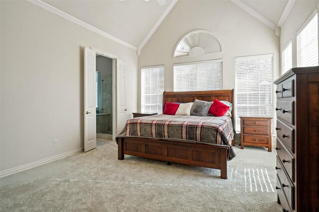 bedroom with high vaulted ceiling, crown molding, connected bathroom, and light carpet