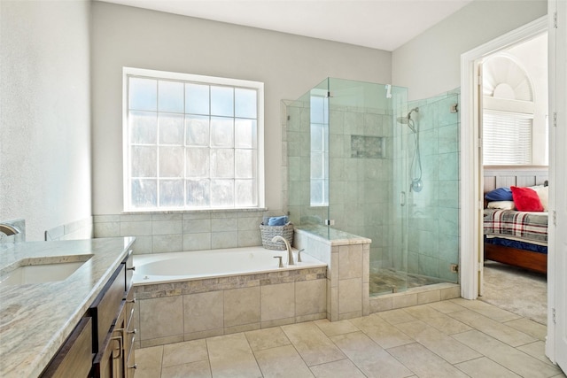 bathroom featuring plus walk in shower and vanity