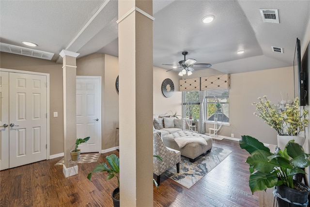 bedroom featuring ornate columns, ceiling fan, dark hardwood / wood-style flooring, a textured ceiling, and lofted ceiling