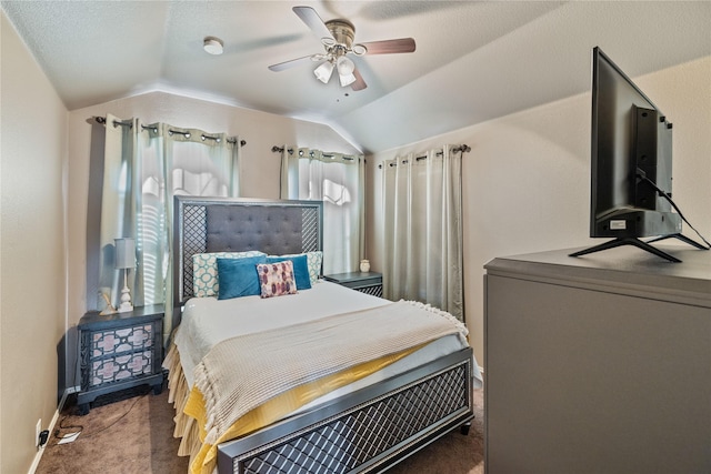 bedroom featuring dark colored carpet, ceiling fan, and lofted ceiling