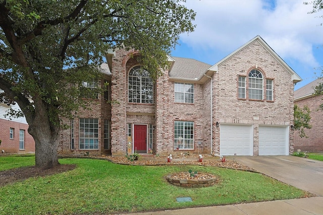 view of front of home featuring a garage and a front lawn