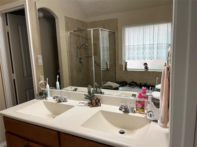 bathroom featuring vanity and plus walk in shower