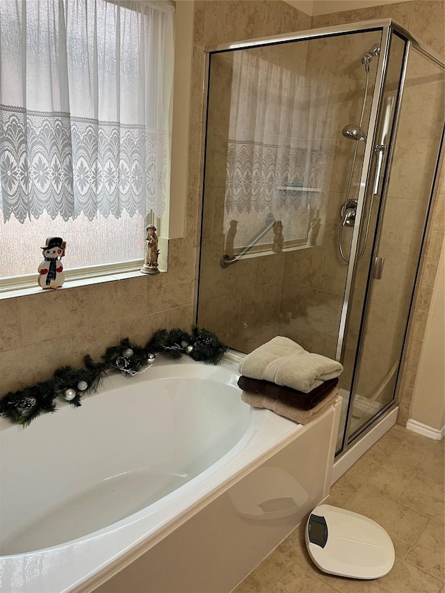 bathroom featuring tile patterned floors and plus walk in shower