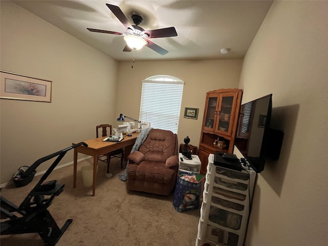 carpeted home office with ceiling fan