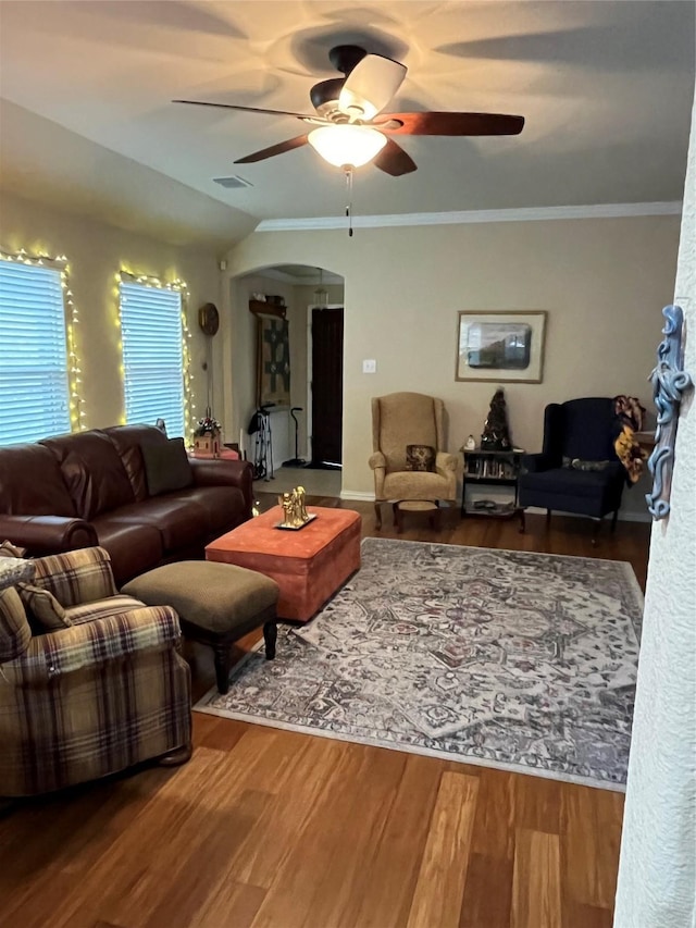 living room with ceiling fan, ornamental molding, and hardwood / wood-style flooring