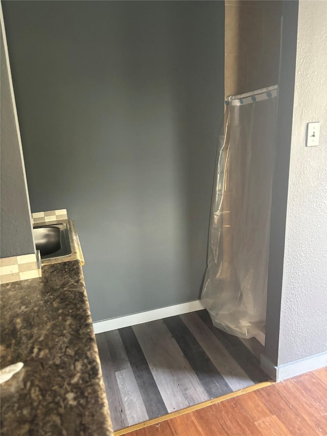 bathroom featuring hardwood / wood-style flooring and sink