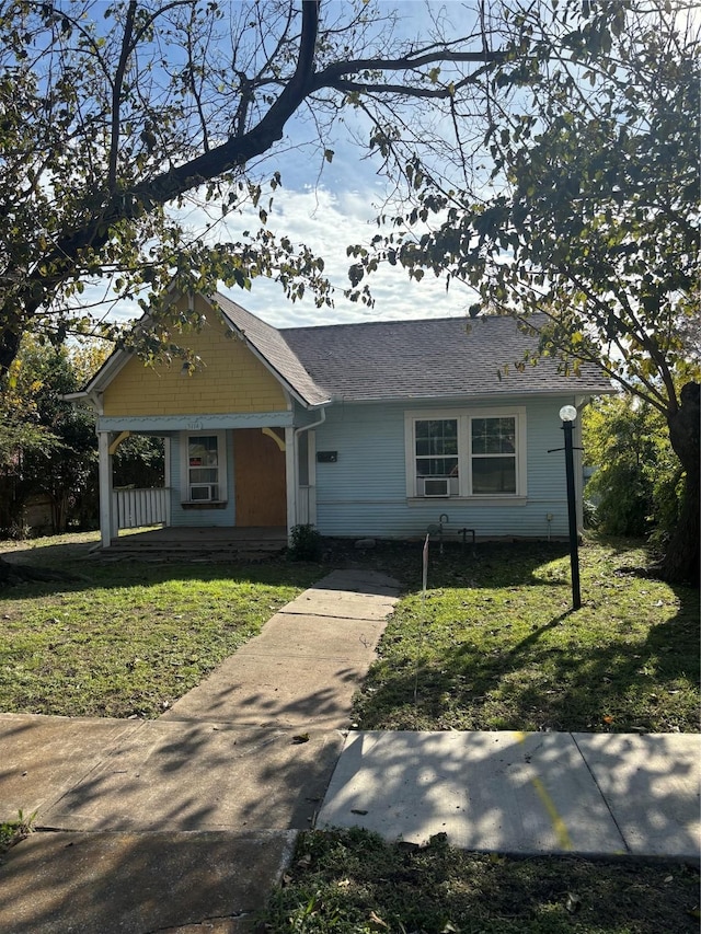 view of front of house featuring a porch and a front lawn