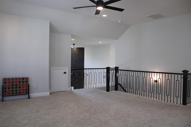 unfurnished room featuring ceiling fan, carpet, and lofted ceiling