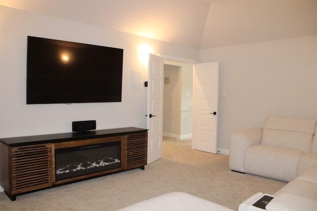 living room featuring carpet and lofted ceiling