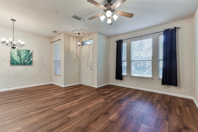 foyer entrance featuring ceiling fan with notable chandelier and dark hardwood / wood-style floors