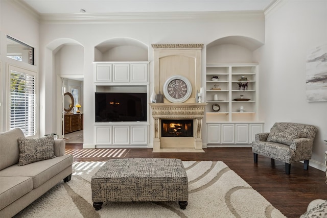 living room featuring dark hardwood / wood-style floors and ornamental molding