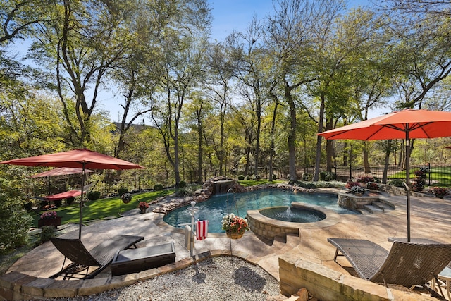 view of swimming pool featuring an in ground hot tub, pool water feature, and a patio