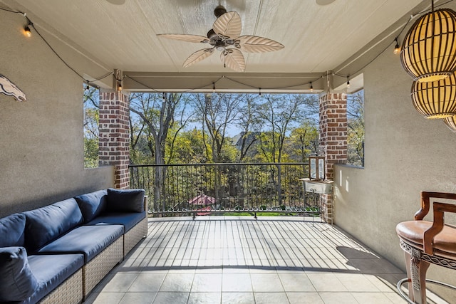 exterior space with an outdoor hangout area and ceiling fan