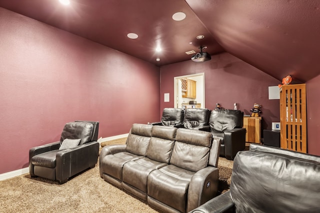 carpeted cinema with vaulted ceiling