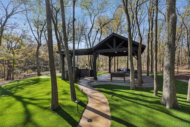 surrounding community with a gazebo and a lawn