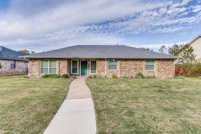 ranch-style house featuring a front lawn